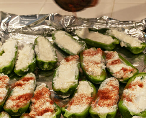 Sprinkle the stuffed peppers with a dusting of festive paprika
